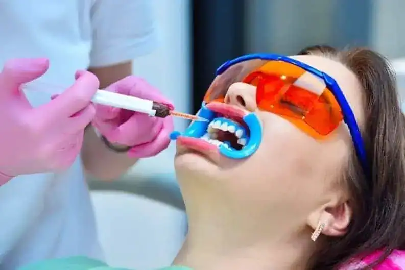 Patient experiencing Laser Teeth Whitening while wearing protective eyewear Abingdon